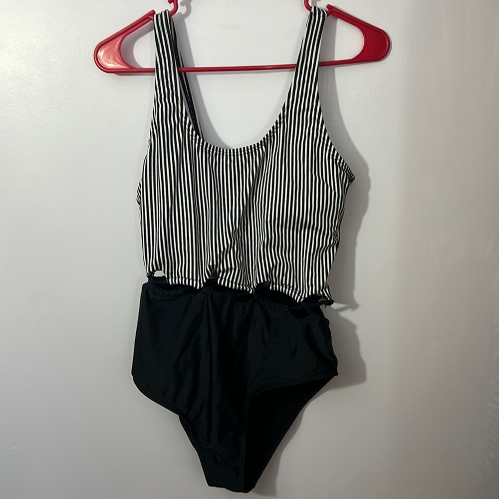 Bebe one piece, black and white, size L, flattering